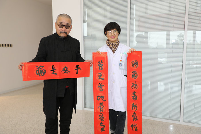 我院连续三年举办“迎春送福”写春联活动_0002.jpg